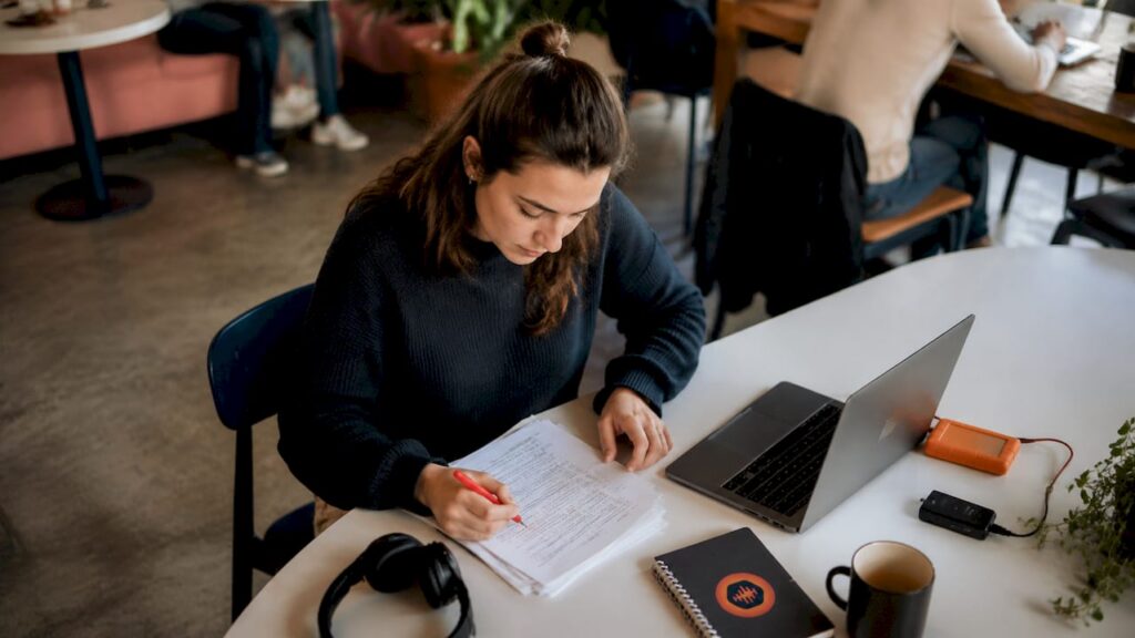 Audio producer reviewing client feedback notes