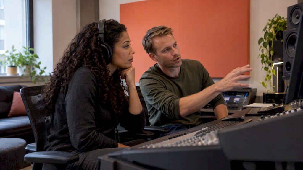 Audio collaborators discussing a mix revision